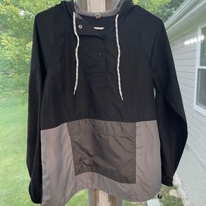 So black , white, and gray wind breaker Size Medium in good condition